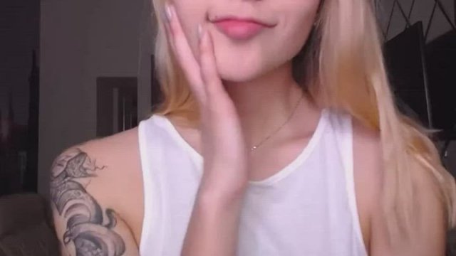 Smiling girl with tattoo on shoulder
