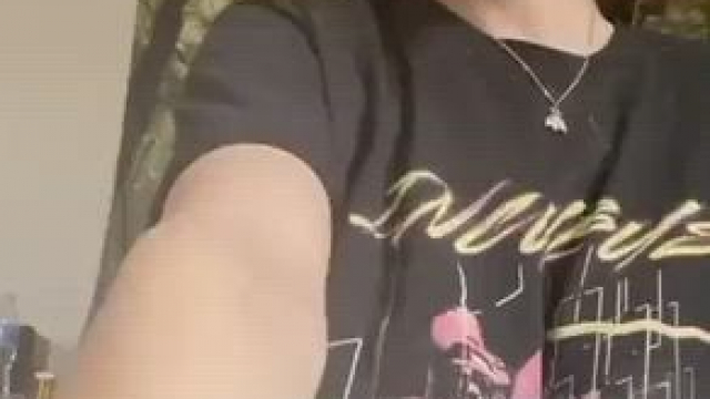 Cute nerdy girl hides a big surprise under her shirt