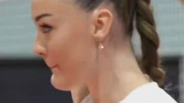She smiles and enjoys the match
