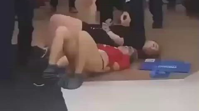 Two girls protesting getting removed from shopping mall