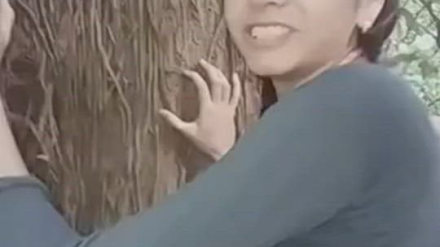 Very cute girl has fun in dense forest