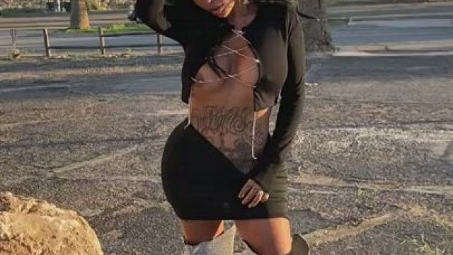 Inked babe flashing